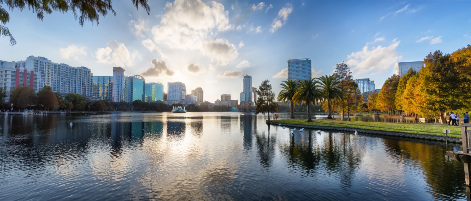 Sunset at Orlando in Lake Eola Park with water fountain and city skyline, Florida, USA