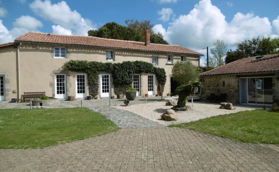 An outdoor shot of a converted farmhouse