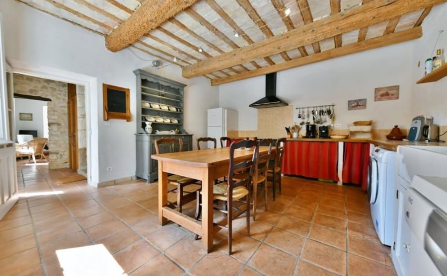 Tiles and exposed beams radiate rustic living in this converted farmhouse