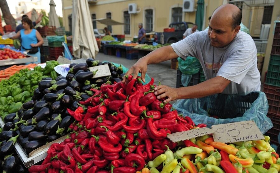 Man selling fruit and vegetables at a market