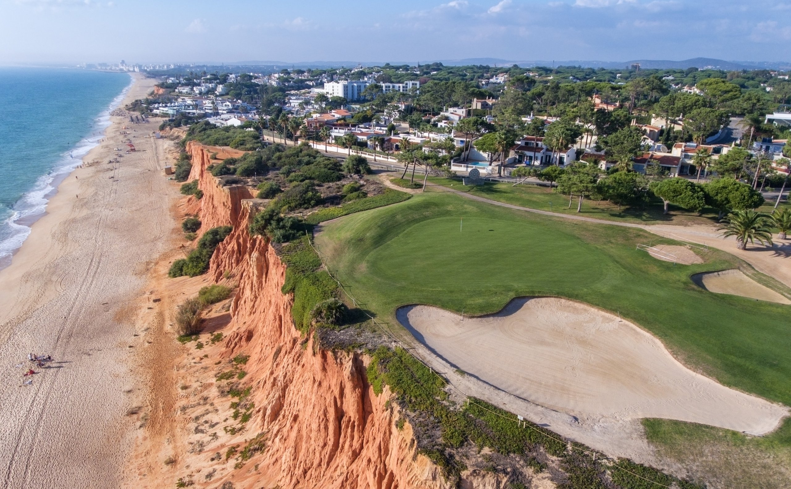 Aerial. View from the sky at the golf courses in the tourist town Vale de Lobo.