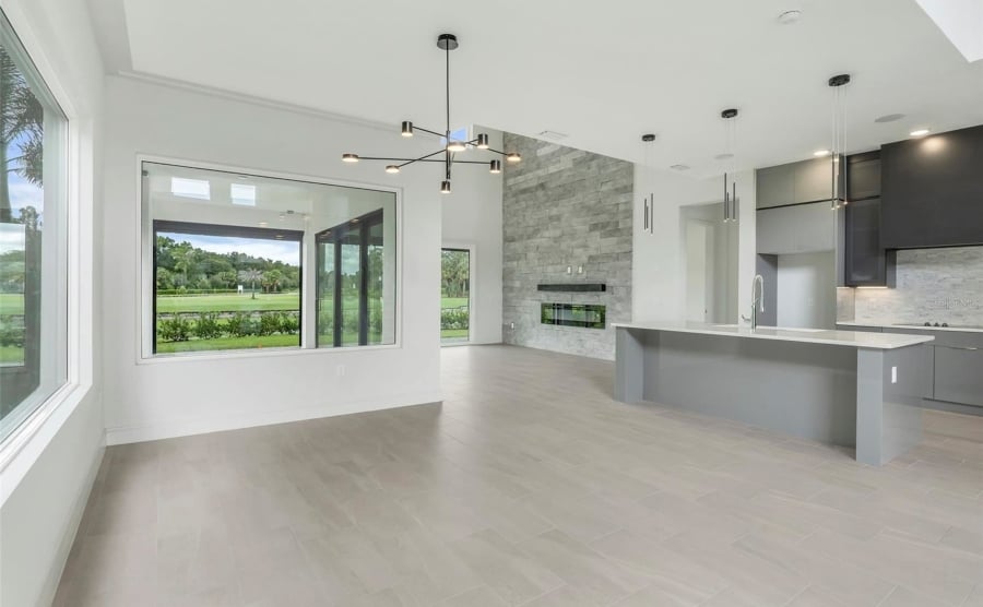 An open plan kitchen and dining room in a Florida home