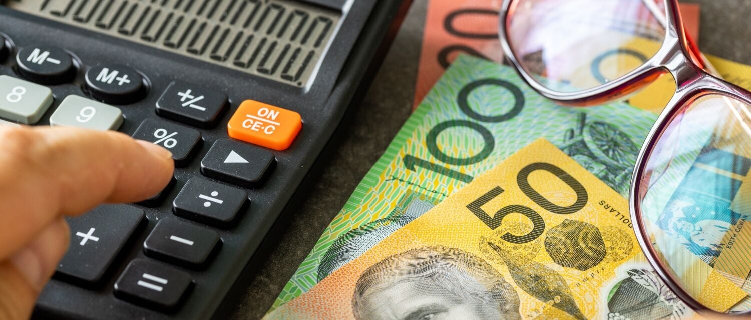 Australian dollar notes and a calculator