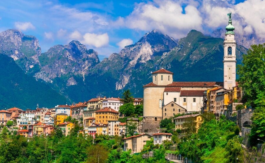 Italian town overlooked by mountains