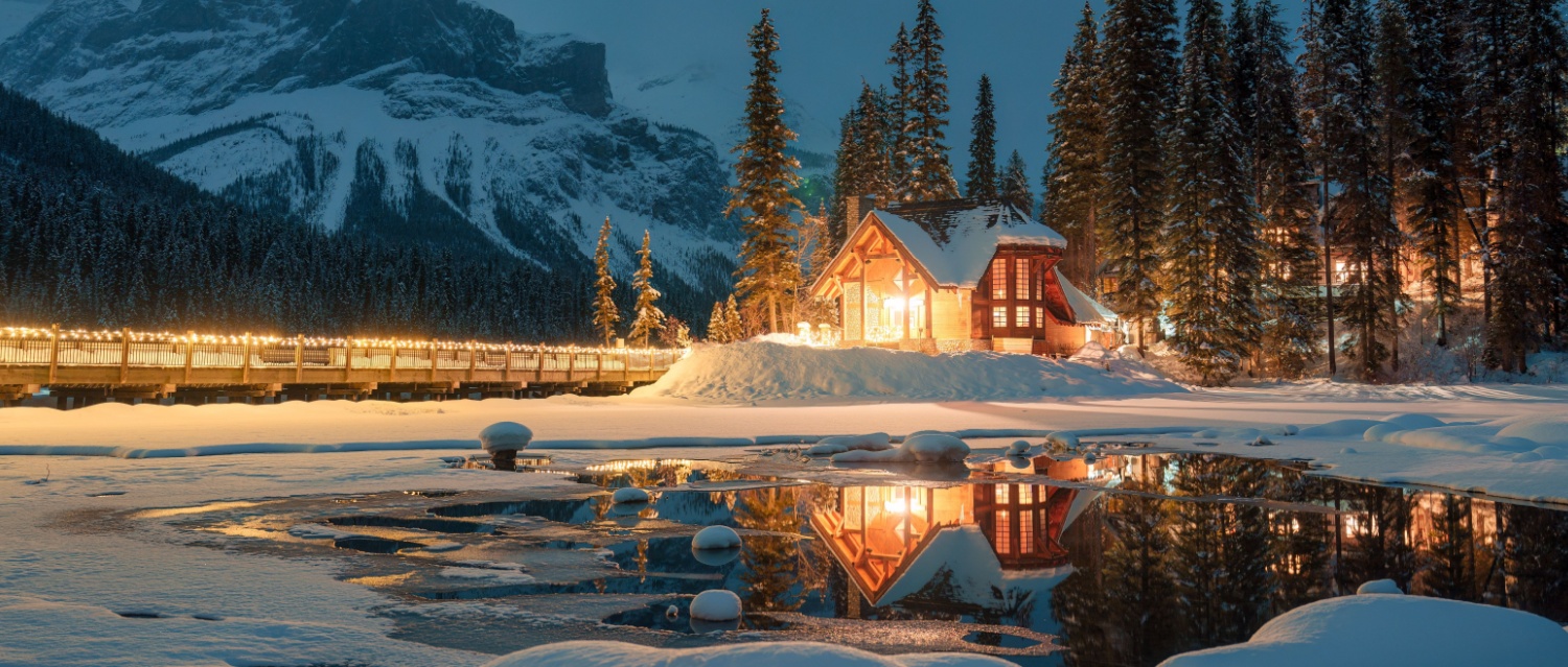 A Canadian lodge lit up against the night