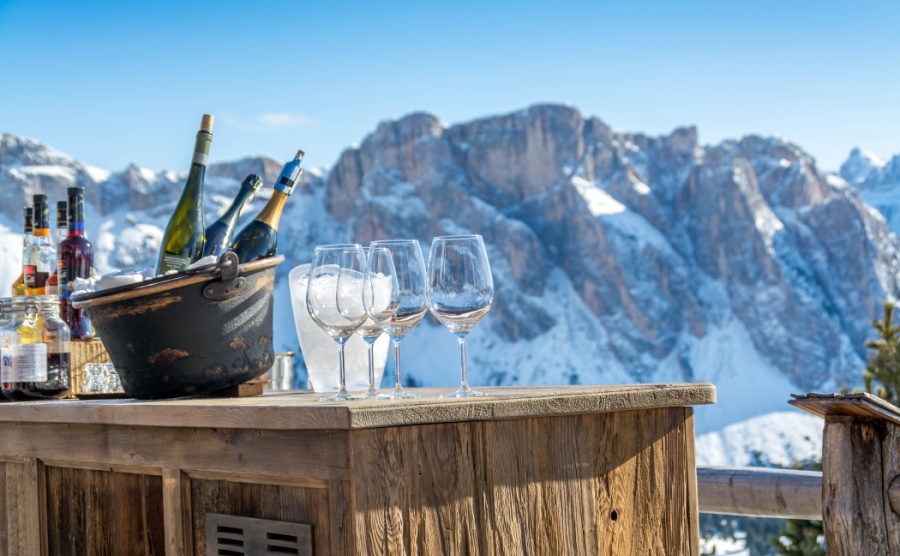 Bottles of prosecco served in ice at the top of a mountain