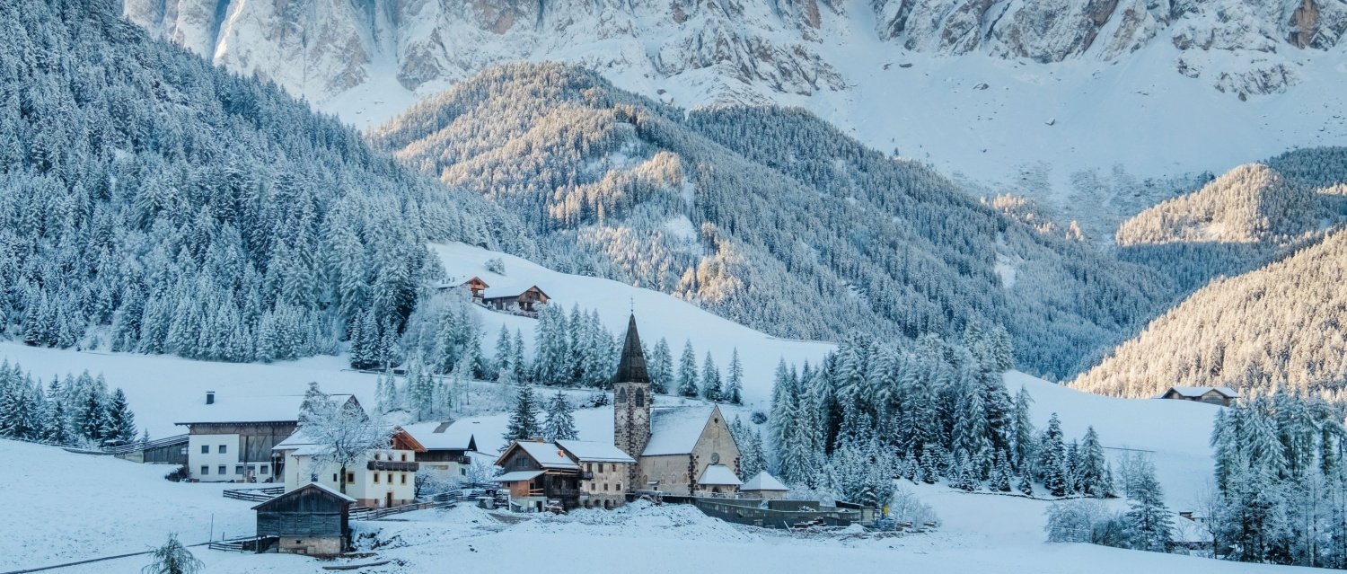 Dolomite ski chalet in a snow-covered valley