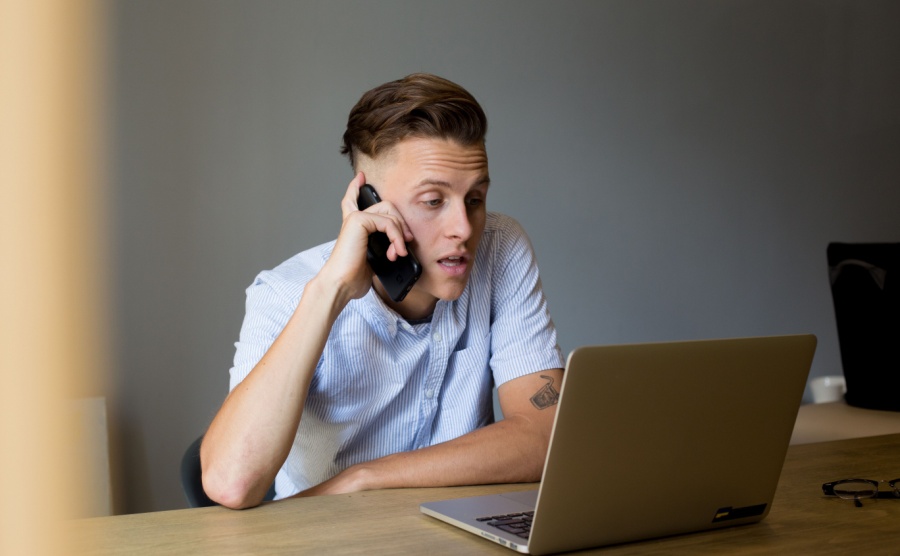 Man on phone deals with overseas clients