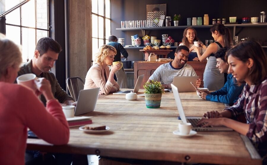 People working in an internet cafe