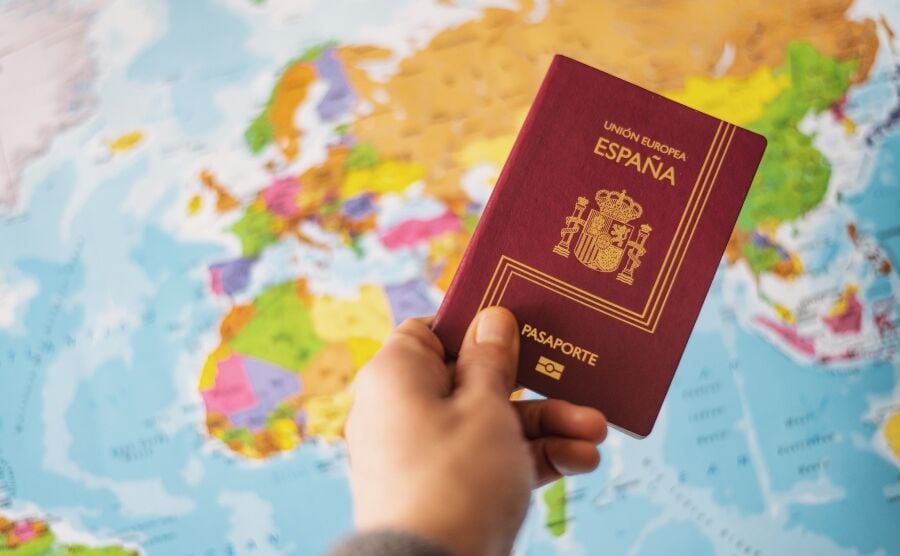 Spanish passport and world map