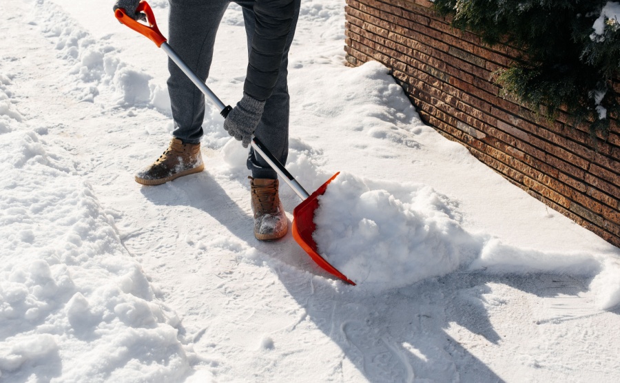 A person shovelling snow