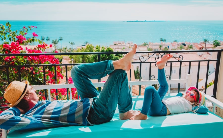 Father and daughter on balcony