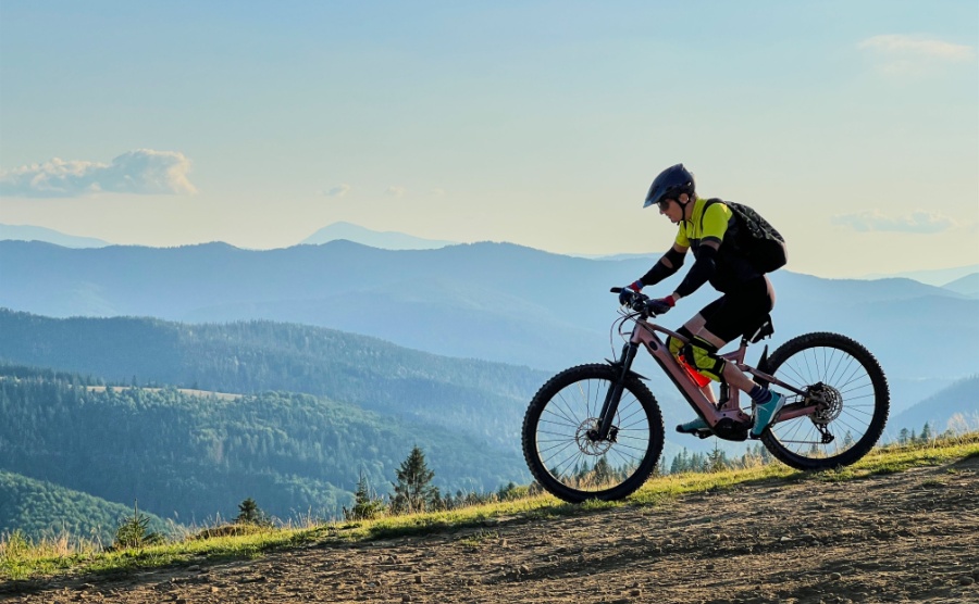 A man riding an e-mountain bike in the hills