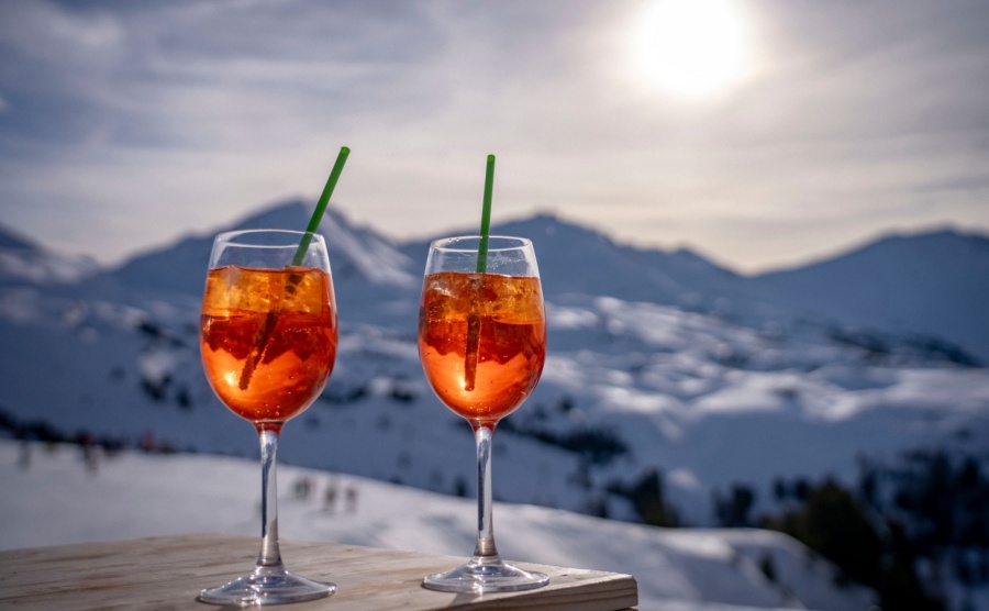 Drinks in front of a snow-covered mountain