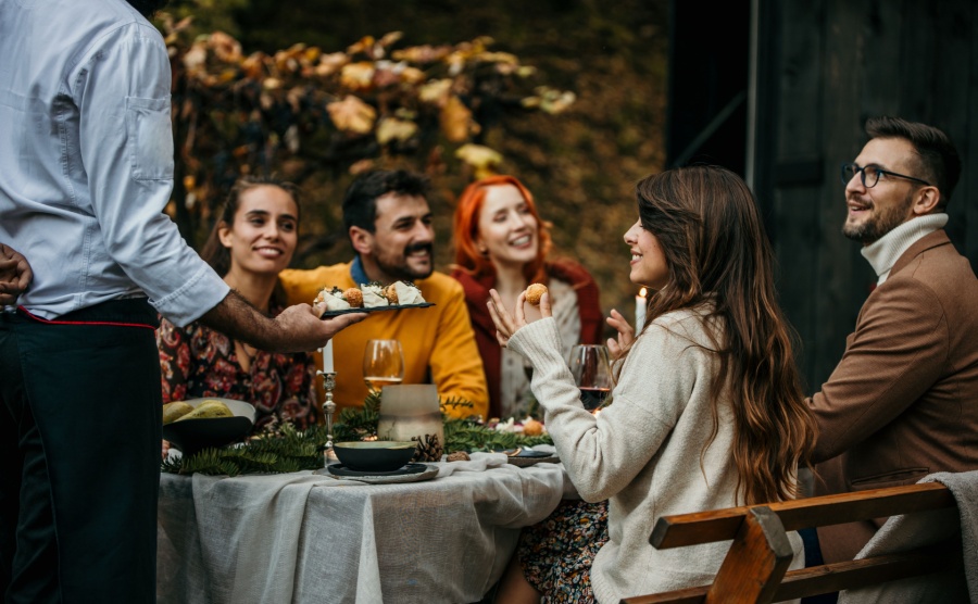 A private chef serving a party