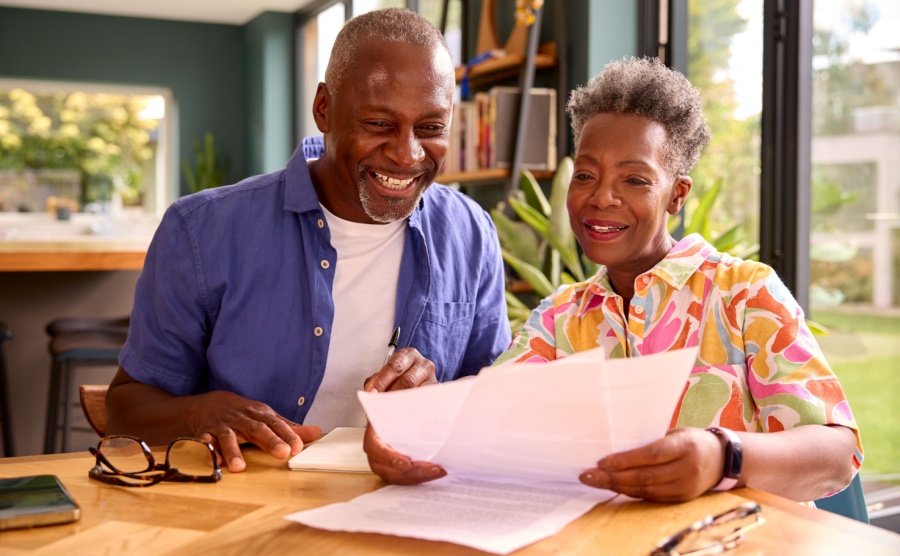 A couple looking at their visa application